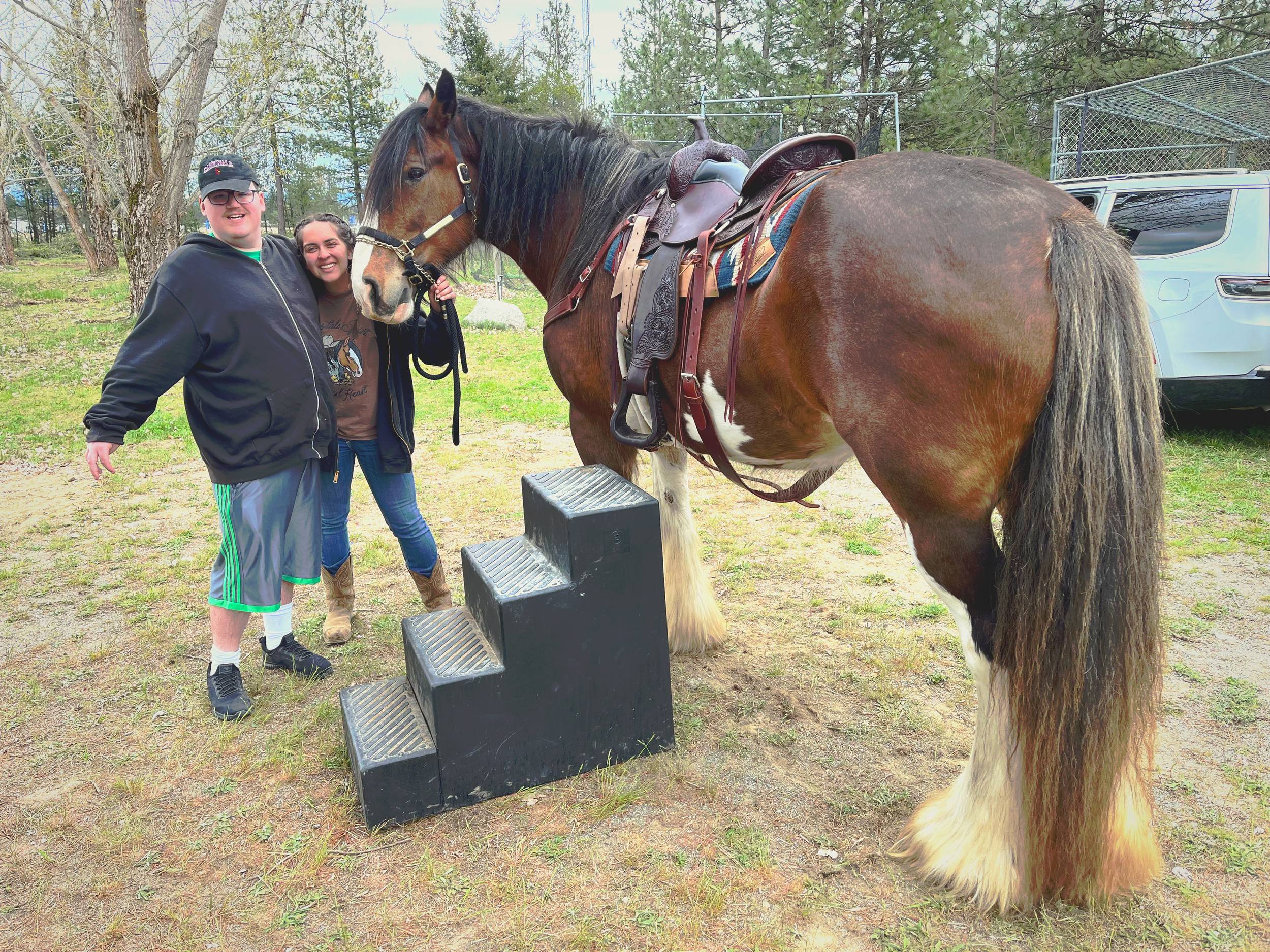 Couple photographed with Clydesdale horse — North Idaho event photography