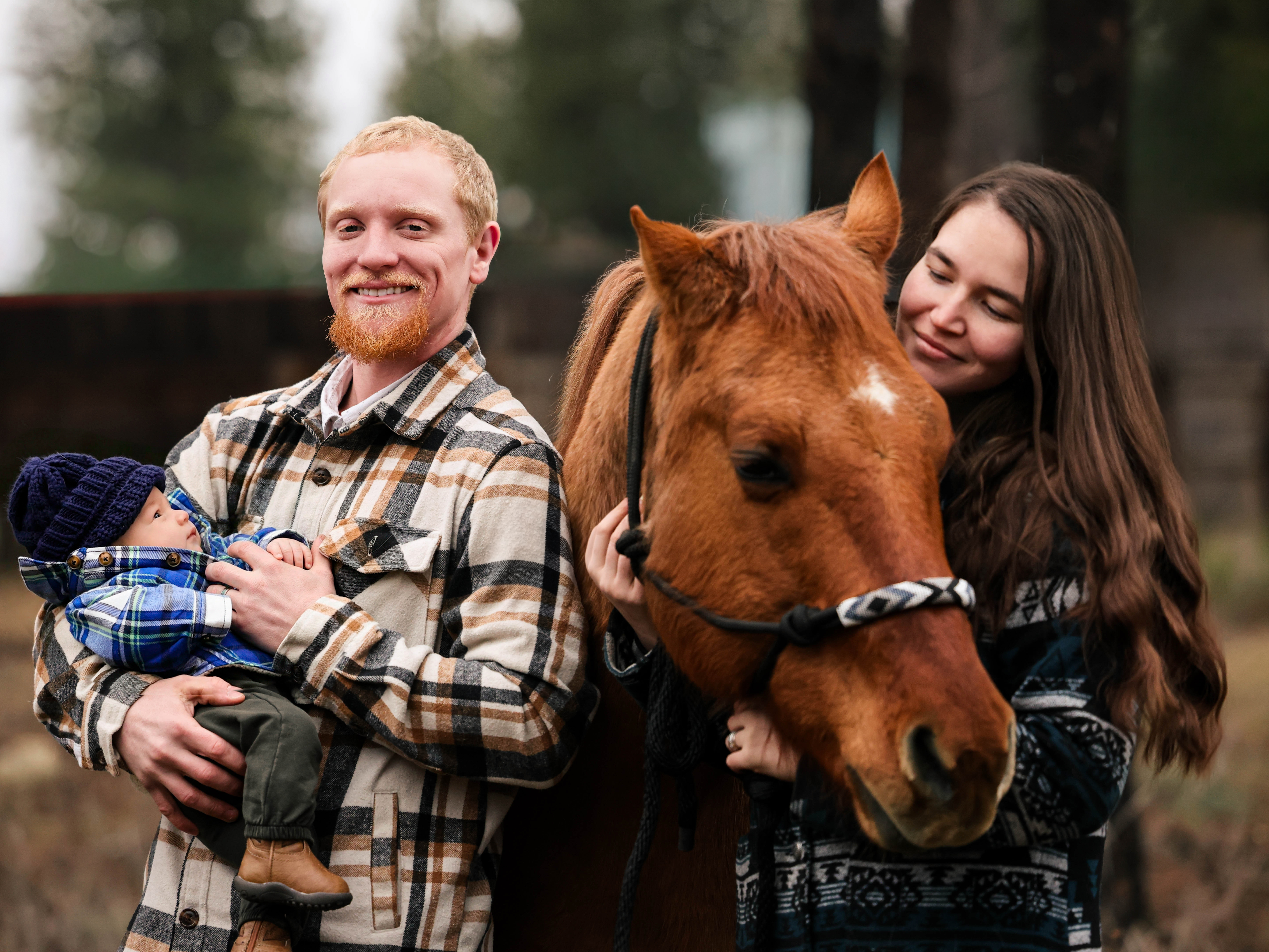 Family portrait with baby and horse at North Idaho ranch — Tribal Cowboy equine portrait session