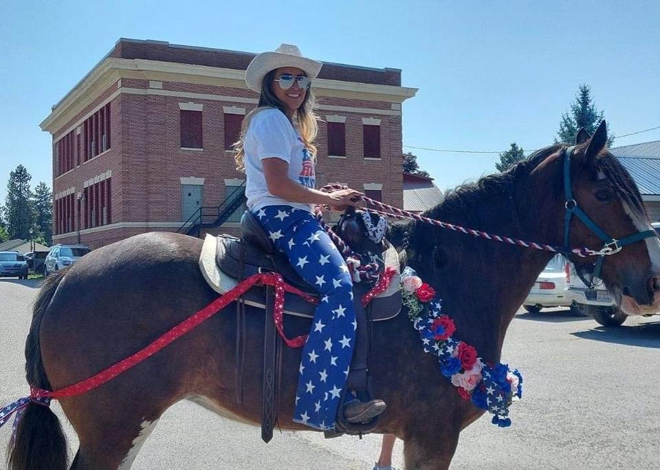 Stacie Huffhines on horseback at a North Idaho community parade